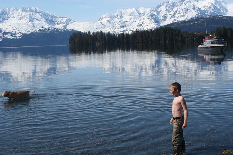 Alaska cove with boat in background